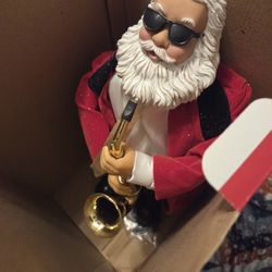 Holiday Time Saxophone Playing Santa Claus Animated Original Box Doesn't Dance or move 
Music works 
Box is faded