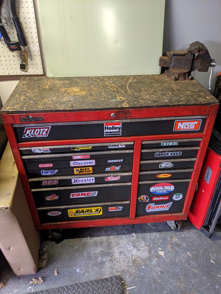 Large rolling toolbox with vise and tools in every drawer