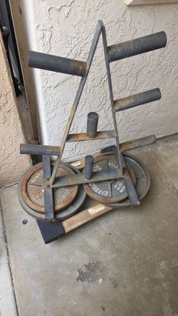.65 per pound. 2 inch metal weights 2x45lb, 2x35lb, and rack