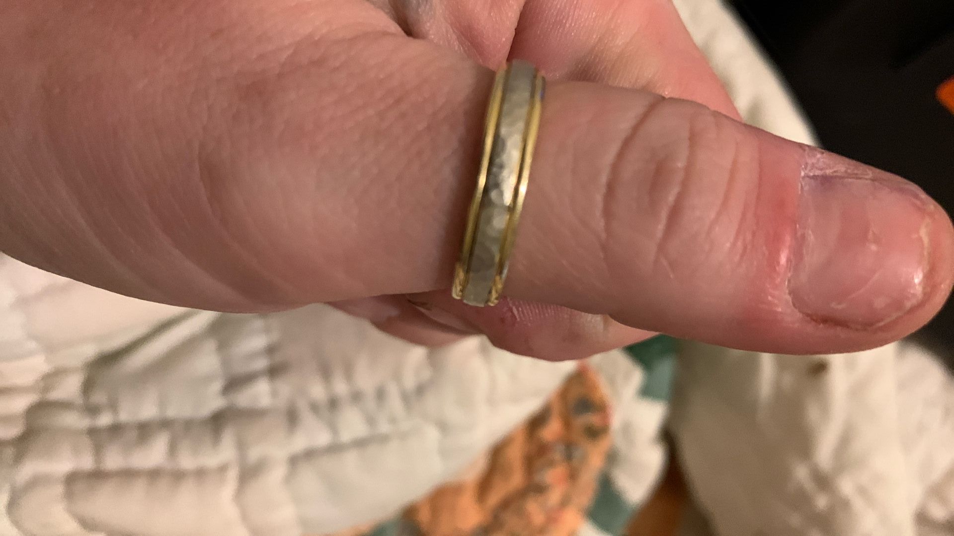 This is a Vintage Fredrick Goldman White And Yellow gold wedding Band with a hammered finish 13 Ish Size 14 K Gold 