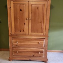 USED KNOTTY PINE ARMOIRE  MADE IN THE USA IN GREAT CONDITION  42" WIDE X 20" DEEP X 62 1/2" HIGH  1 piece
