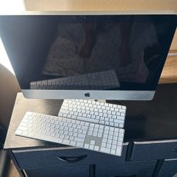 Apple All-In-One Desktop With Two Keyboards And A Mouse
