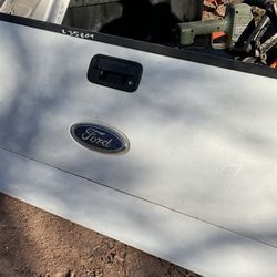 A Ford tailgate it’s 26 nches tall and 64 inches wide 