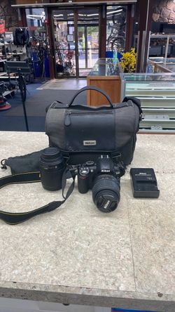 Nikon D3100 14.2 MP DSLR w/18-55mm AND 55-200mm 1 battery and charger men card and bag..70490766