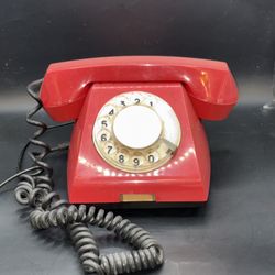 retro rotary phone manufactured by Tesla in the 1980s, featuring a distinctive red color. This vintage telephone hails from Slovakia 