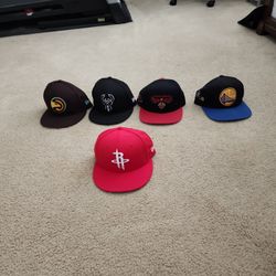 Assorted NBA hats