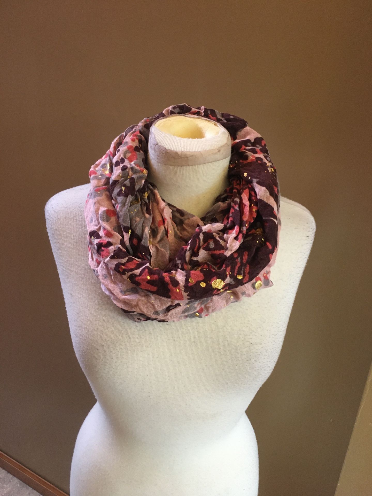 Charming Charlie Infinity scarf with multicolor design, pink, grey, burgundy, and gold