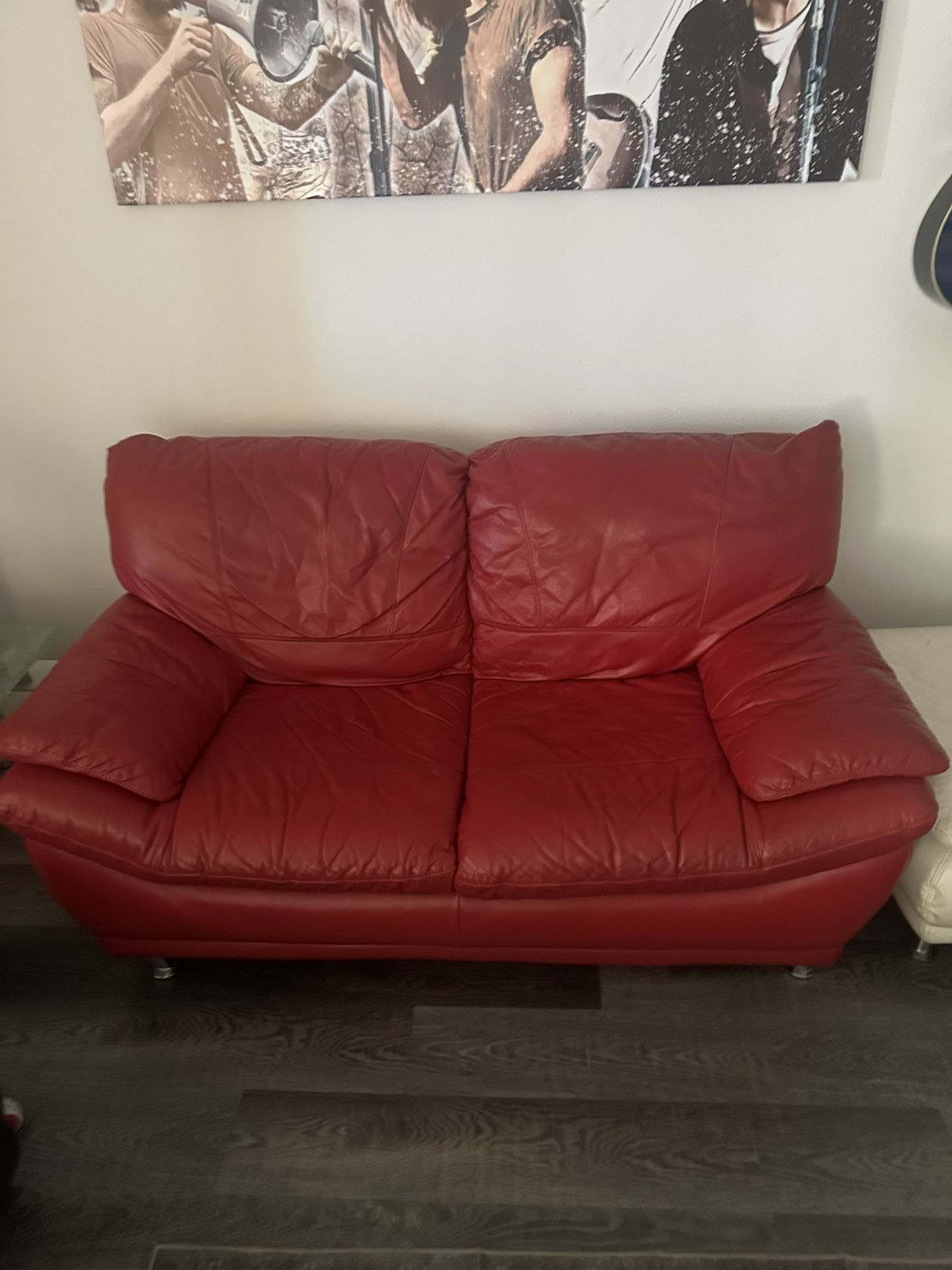 Real red leather love seat and matching white leather ottoman