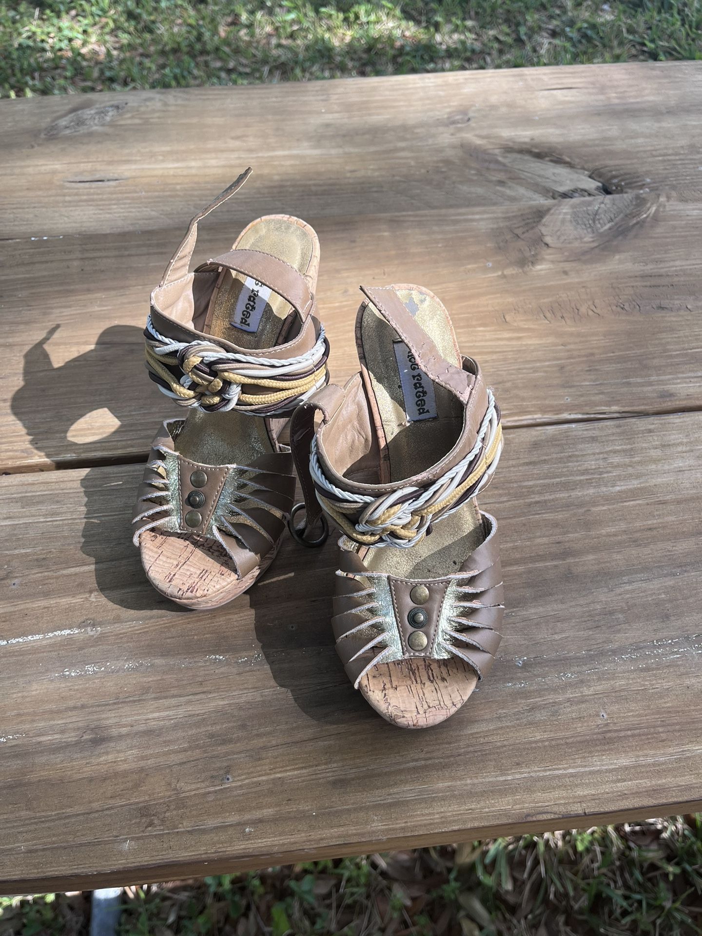 Brown and tan leather wedges with rope detailing and cork sole
