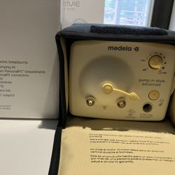Medela: (1) double electric breastpump 
