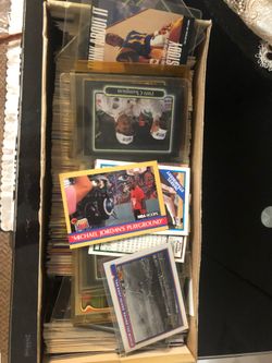 Mixtures of racing cards, baseball cards, and basketball cards
