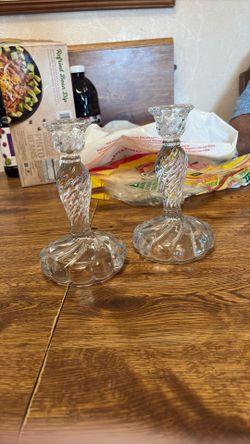 Two Glass Candle Holders With A Swirl Design
