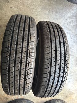 Set of 2 nice tires 215/70/16 ( We install & balance)