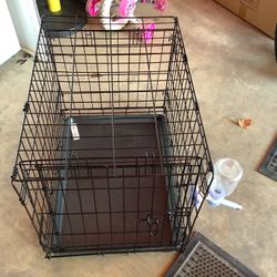 Midwest medium size dog crate, like new condition approximately 24” long, 17” wide and 19” tall.  No rust, no cracks in pan, easy open and 