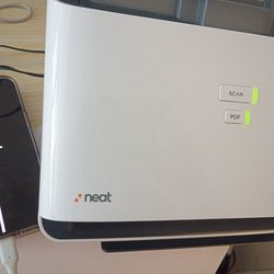 Is that little fax machine it's made by neat it faxes documents receipts and cards