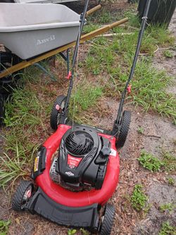 2 lawnmowers, husky 6 cu flat free wheelbarrow, hand truck dolly