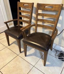 Pair of solid wood arm chairs