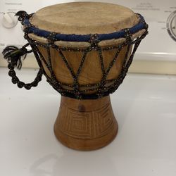 Awesome hand-carved wooden bongo drum in great condition.