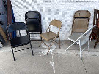 Nine metal folding chairs for sale