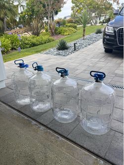 Four 5gallon glass water bottles