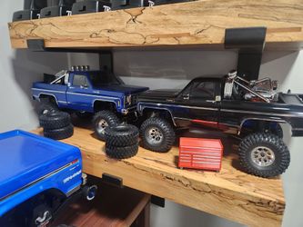 2 trx4m traxxas new crawlers silverado k10 one blue and one black with manuals and some goodies