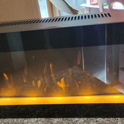 Electrical fireplace with moving flame effects