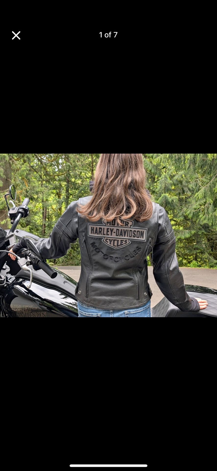 Harley Davidson leather jacket with a removable zip-up hoodie.