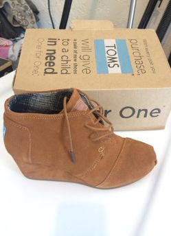 TOMS brand new. Brown suede wedge. Size 7