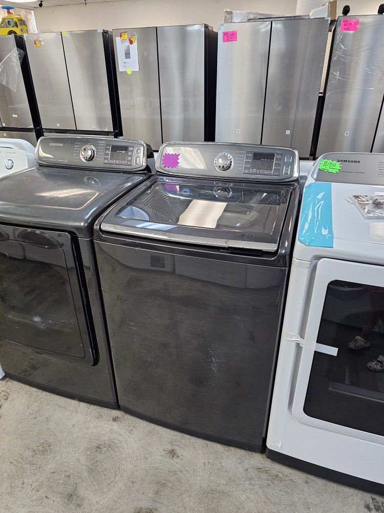 SAMSUNG STEAM BLACK STAINLESS STEEL TOP LOAD WASHER AND GAS DRYER SET WITH MIDDLE GASKET 