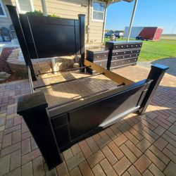 Ashley Furniture almost black bedroom set. Queen bed frame dresser nightstand. Drawers work well. Fair condition. delivery available