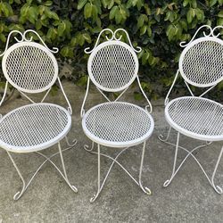 3 wrought iron chairs