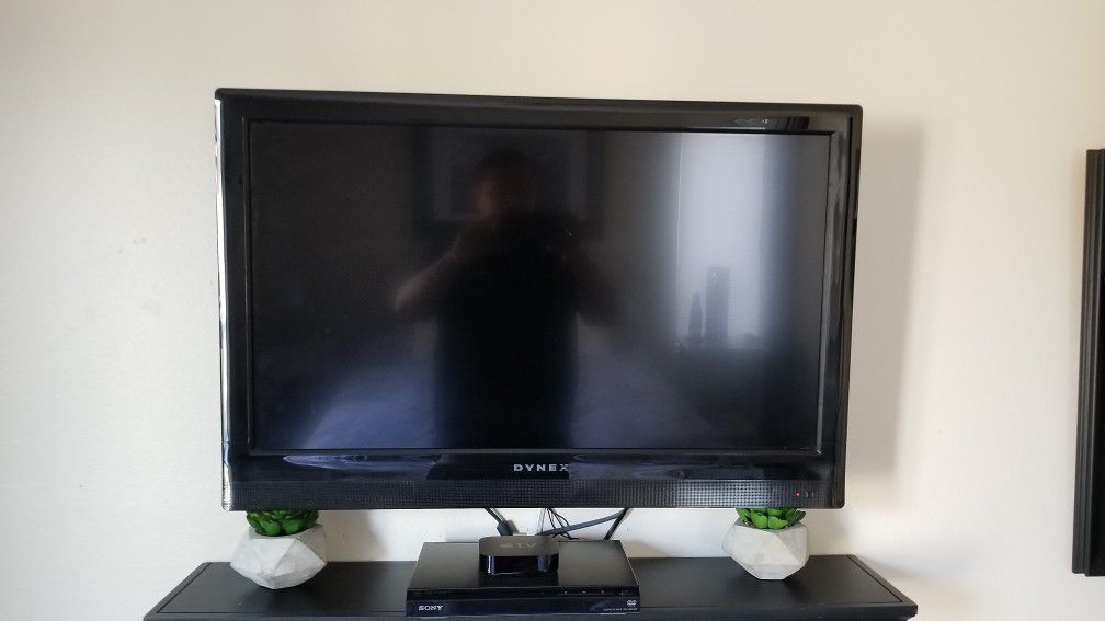 42" Dynex Flat Screen TV with stand.