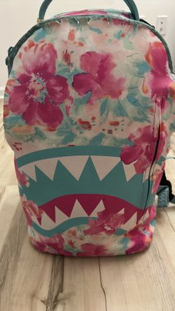 Floral teal and pink spray ground backpack