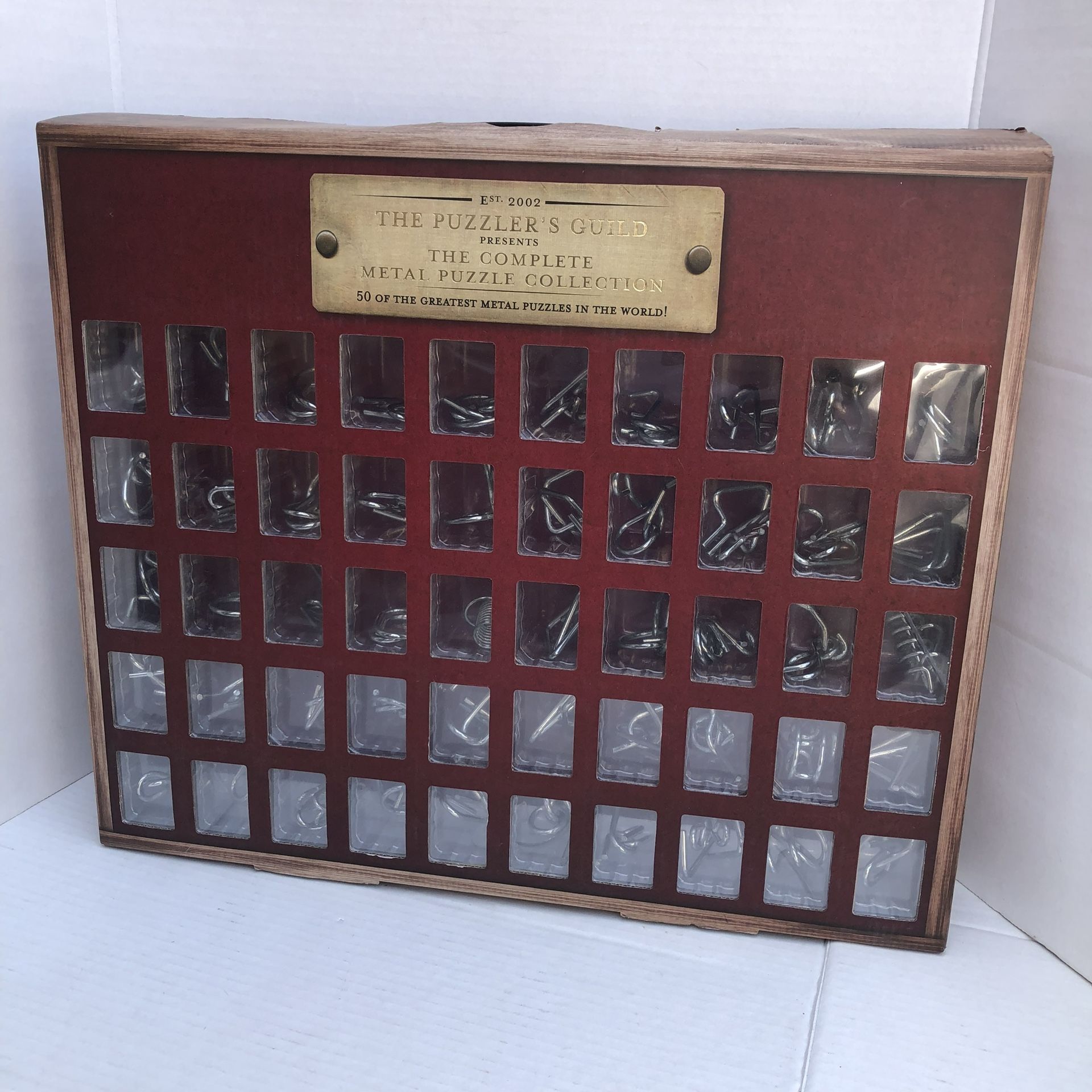 Game The Puzzler's Guild Complete Metal Puzzle Collection. like new, opened but never used, just been siting on the shelf. Comes exactly as pictured.