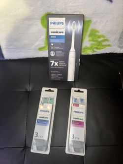 White Sonic care Toothbrush With 6 Replacements Heads