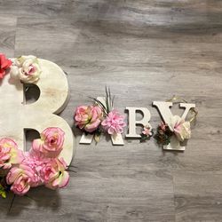 Letters spell BABY (1st Letter B is metal and rest of 3 letters are wooden) ALL for $10 Some flowers  need to be hot glued on