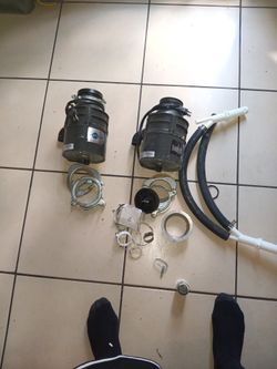 Two Garbage Disposal Machines