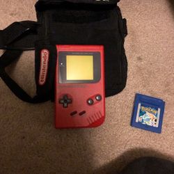 Nintendo gameboy with case and Pokémon blue