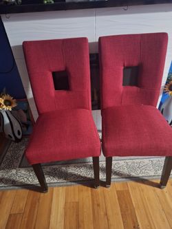 Accent   burgundy upholstered chairs.