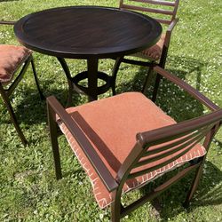 metal patio set, three chairs and a round table, cushions included! all in good condition