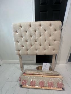 Brand new twin tufted linen bed frame