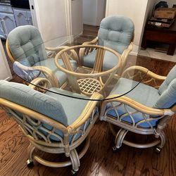 Palm Springs Rattan Glass Top Table with 4 Rolling Chairs