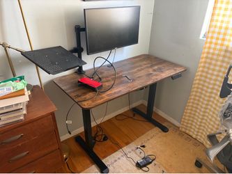 Adjustable work desk with monitor
