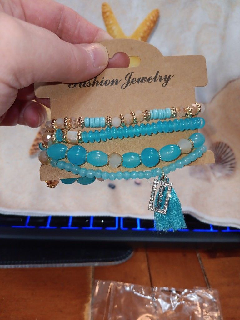 Turquoise Beading Stretch Bracelet With Charm And Tassle