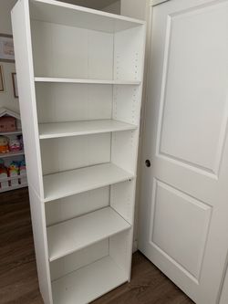Tall white bookshelf