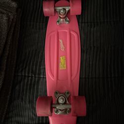 Hot pink penny skate board