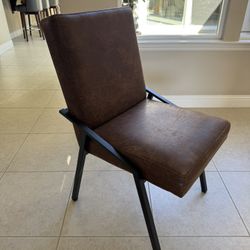 8 Brand New Ashley Dining Chairs . Brown Faux Leather. $600 OBO