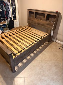 Full size brown bed