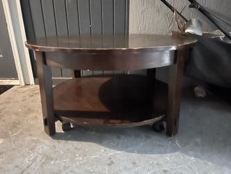 Dark Wood Round Coffee Table with Casters