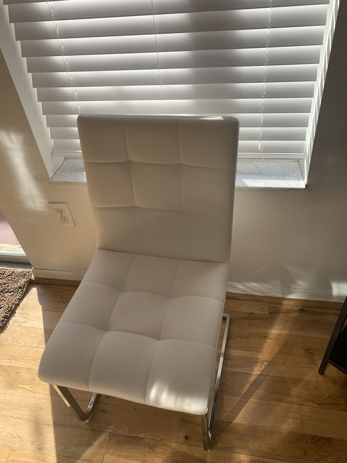 4 White Leather dining room chairs in great condition
